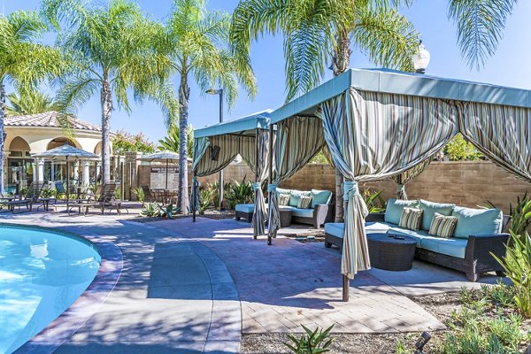 Relaxing pool area surrounded by lush landscaping at Tavera Apartments