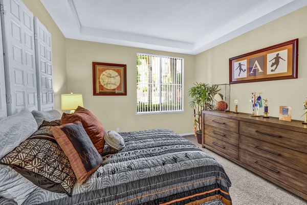 Bedroom featuring modern decor and large windows at Terra Vista Apartments - luxury living by Greystar