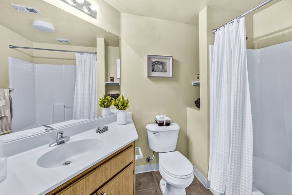 Elegant bathroom with marble countertops and modern fixtures at Terra Vista Apartments