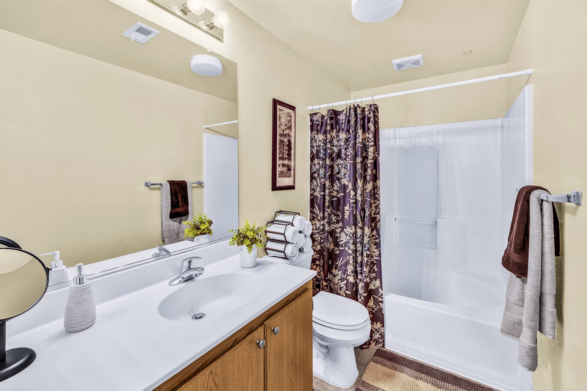 Modern bathroom with sleek fixtures and granite countertops in Terra Vista Apartments, luxury living for Greystar residents
