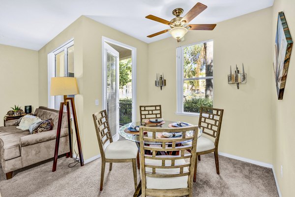 Dining room with modern decor and stylish lighting at Terra Vista Apartments