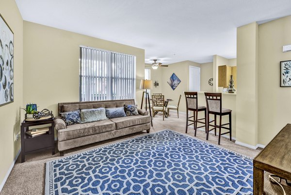 Modern living room with elegant furnishings at Terra Vista Apartments, luxury property by Greystar in scenic surroundings
