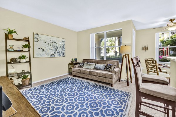 Spacious living room with modern decor in Terra Vista Apartments, offering luxury living in a Greystar community