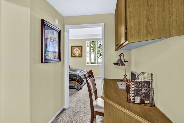 Home office area with modern desk and ergonomic chair at Terra Vista Apartments