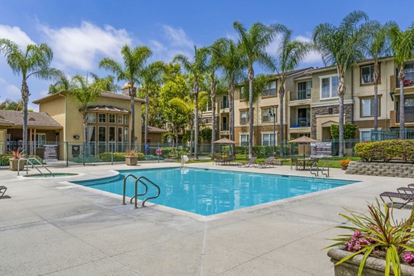 Inviting pool area with lounge chairs at Terra Vista Apartments, offering relaxation and community ambiance for residents