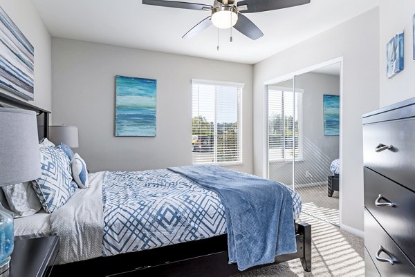 Village Square Apartments: Cozy bedroom with modern furnishings