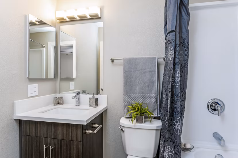 Modern bathroom with sleek fixtures at Village Square Apartments