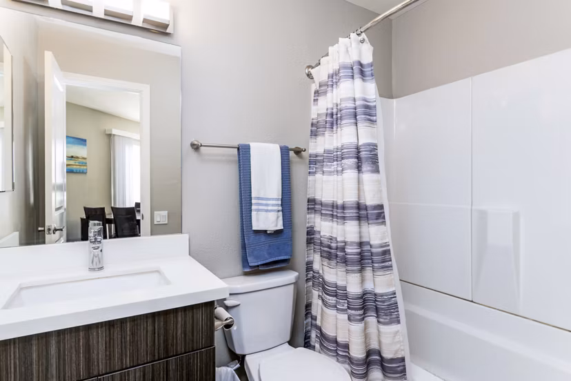 Contemporary bathroom with sleek fixtures at Village Square Apartments