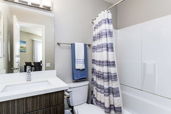 Contemporary bathroom with sleek fixtures at Village Square Apartments