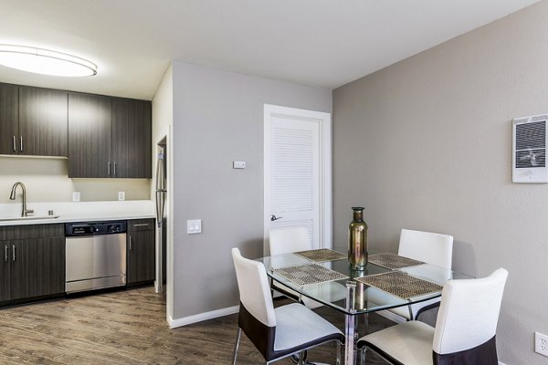 Dining area with modern furnishings in Village Square Apartments