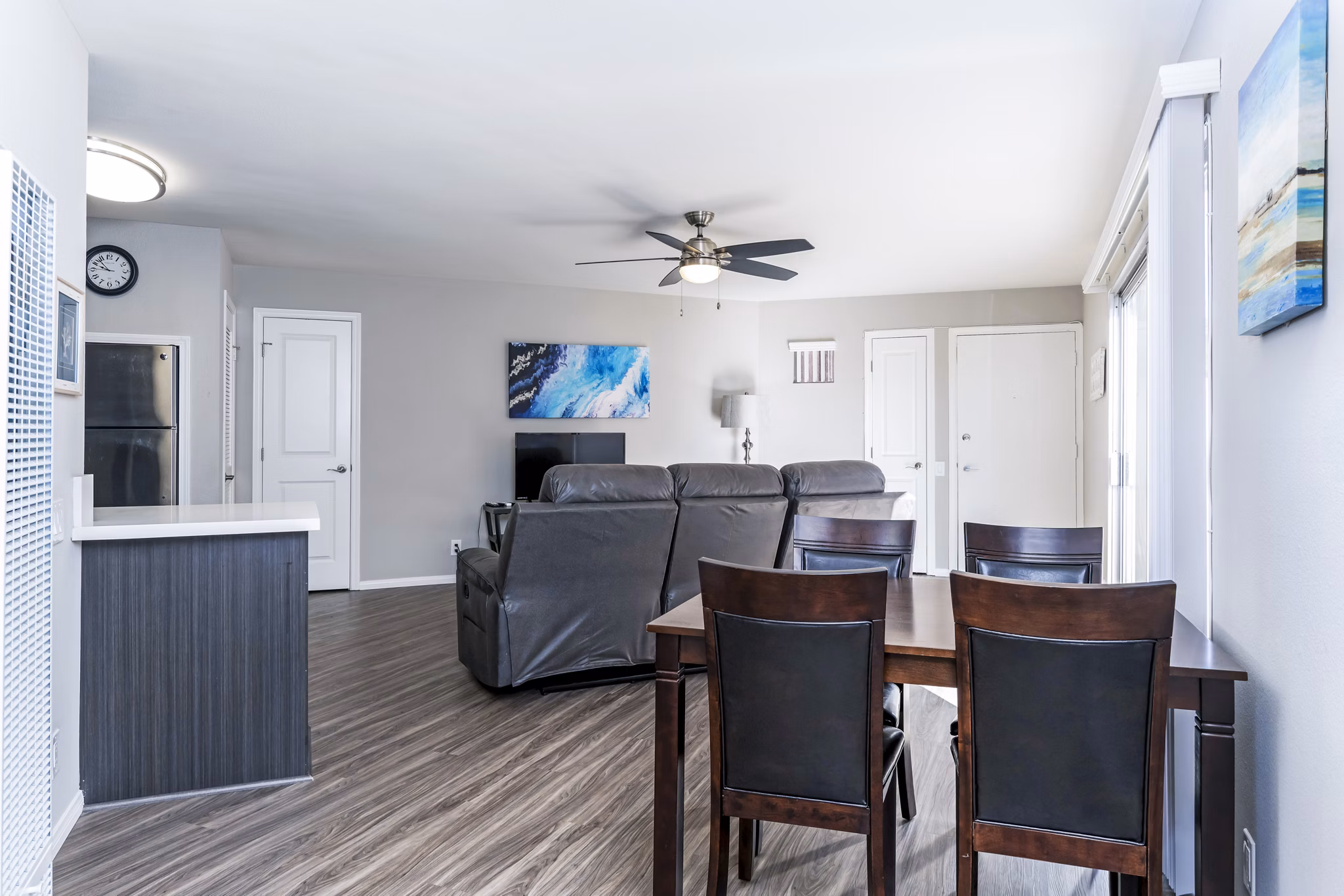 Dining room featuring modern decor and ample natural light in Village Square Apartments