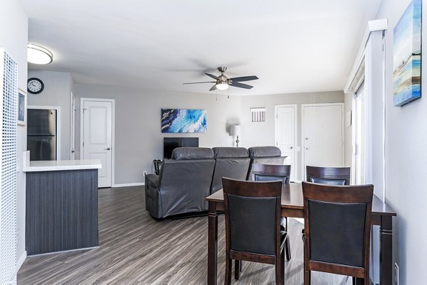 Dining room featuring modern decor and ample natural light in Village Square Apartments