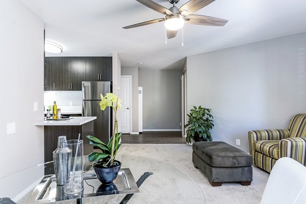 Cozy living room with modern decor at Village Square Apartments
