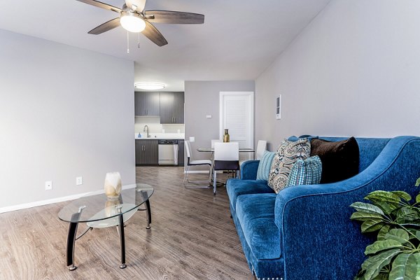 Spacious living room with modern decor in Village Square Apartments