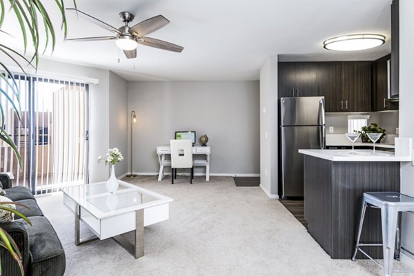 Living room with cozy seating and modern decor in Village Square Apartments