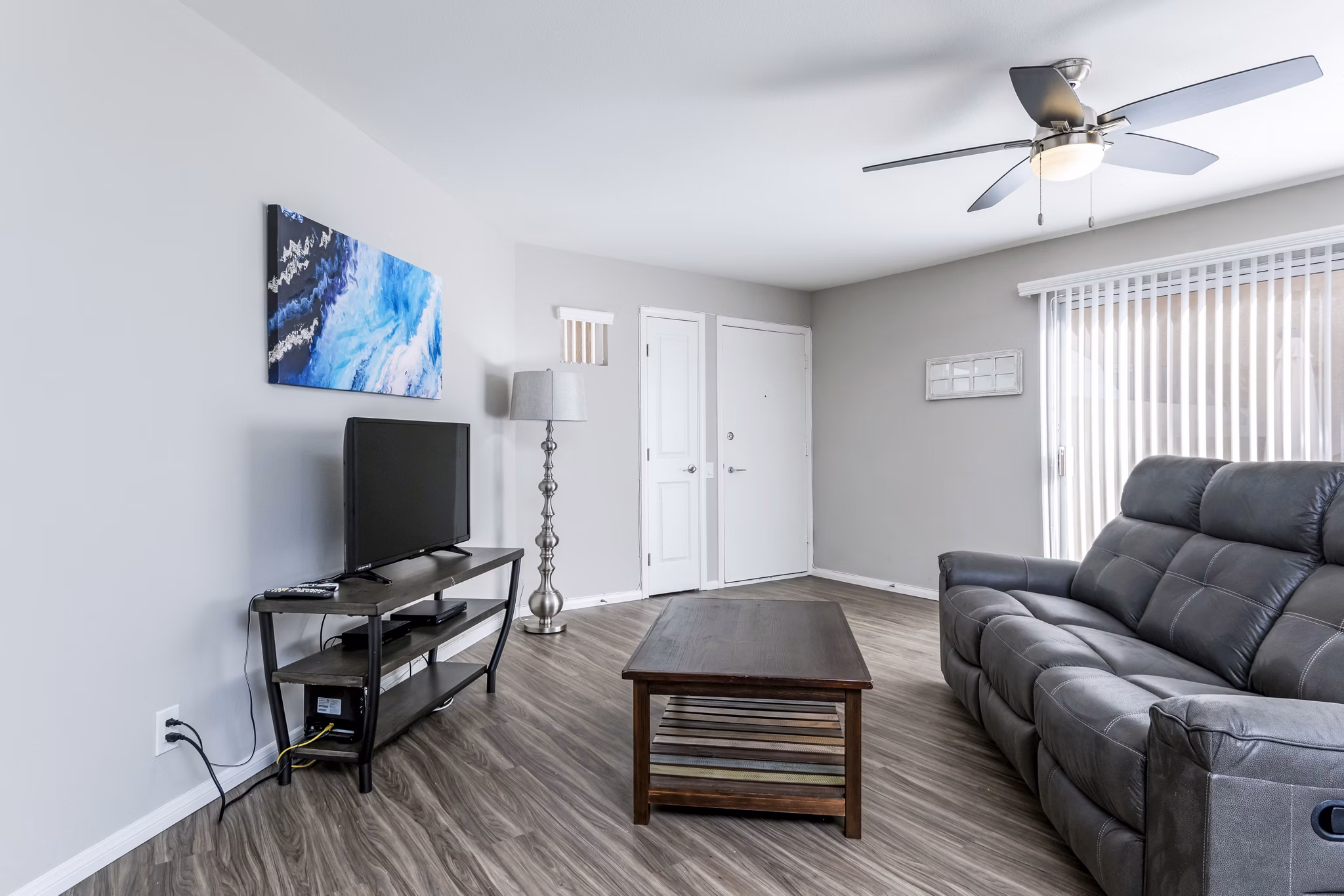 Spacious living room with modern decor in Village Square Apartments