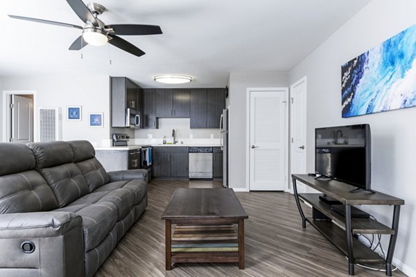 Spacious living room with modern furnishings at Village Square Apartments