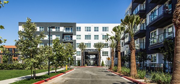 Vora Mission Valley West: Luxury apartment building with landscaped entry in San Diego