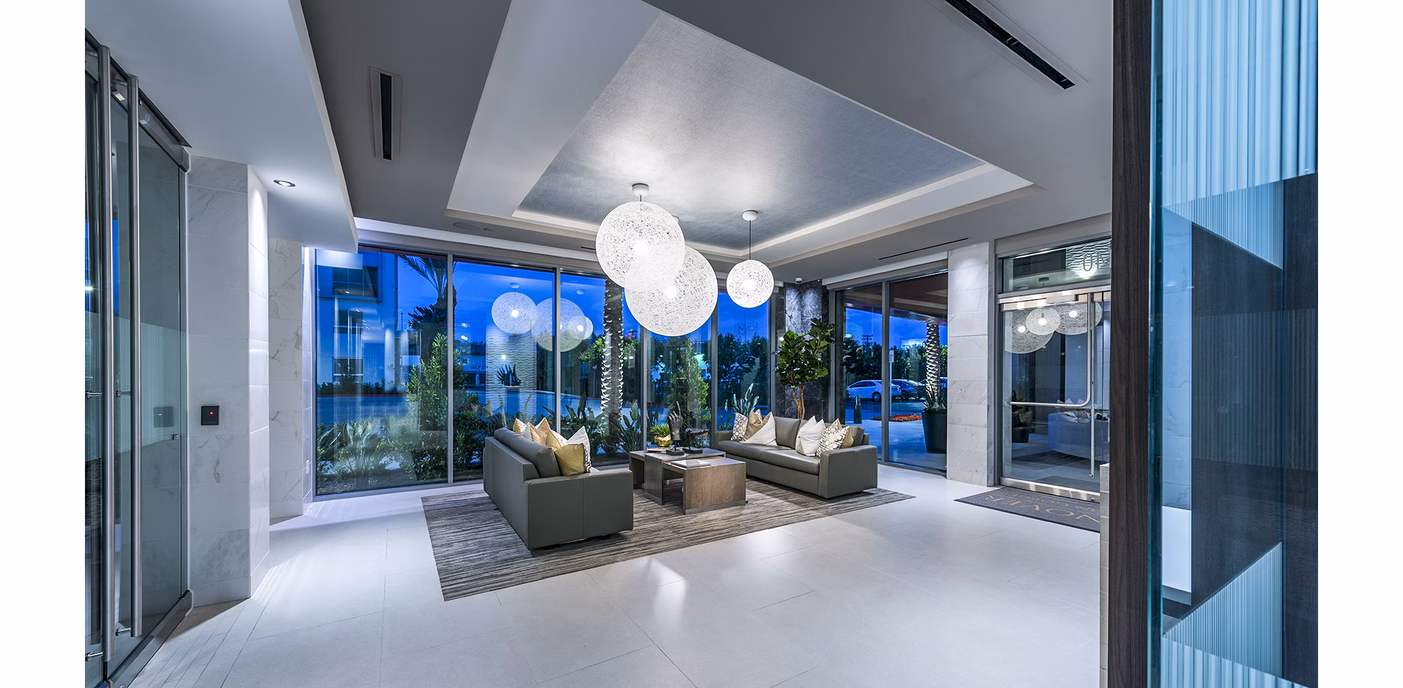 Clubhouse lobby with elegant seating and modern decor at Vora Mission Valley West Apartments