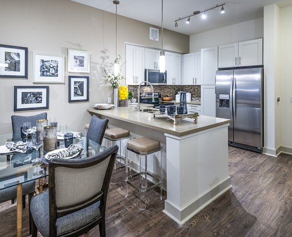 Dining room featuring elegant dining set and modern lighting at Vora Mission Valley West Apartments