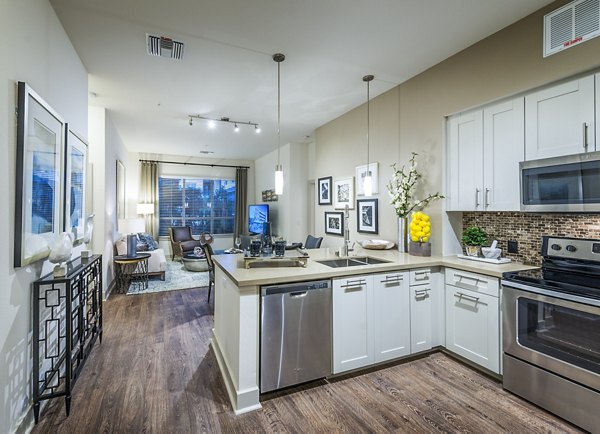 Modern kitchen with stainless steel appliances at Vora Mission Valley West Apartments