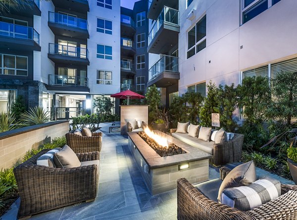 Cozy outdoor fire pit area at Vora Mission Valley West Apartments, perfect for social gatherings and relaxation