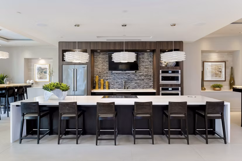 Modern clubhouse kitchen with granite countertops at Vora Mission Valley East Apartments, designed for luxury living in San Diego