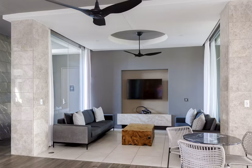 Clubhouse business center with modern workstations at Vora Mission Valley East Apartments, a luxurious Greystar community in San Diego