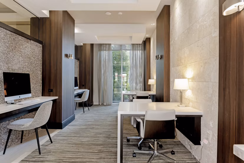 Clubhouse theater with plush seating and large screen at Vora Mission Valley East Apartments