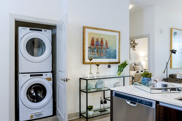 Laundry room with modern appliances at Vora Mission Valley East Apartments, providing convenience and efficiency for luxury living