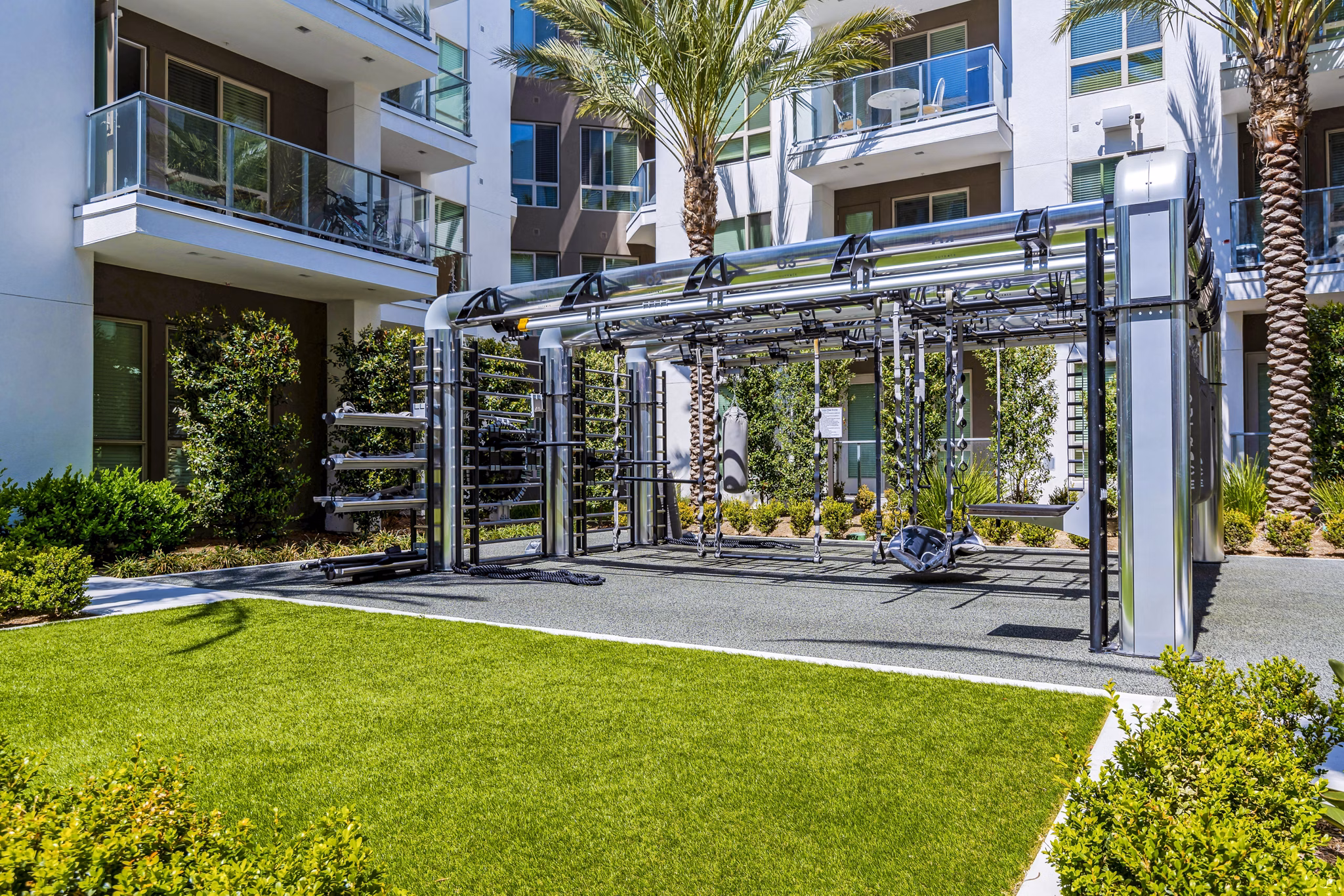 Outdoor fitness center featuring modern equipment at Vora Mission Valley East Apartments