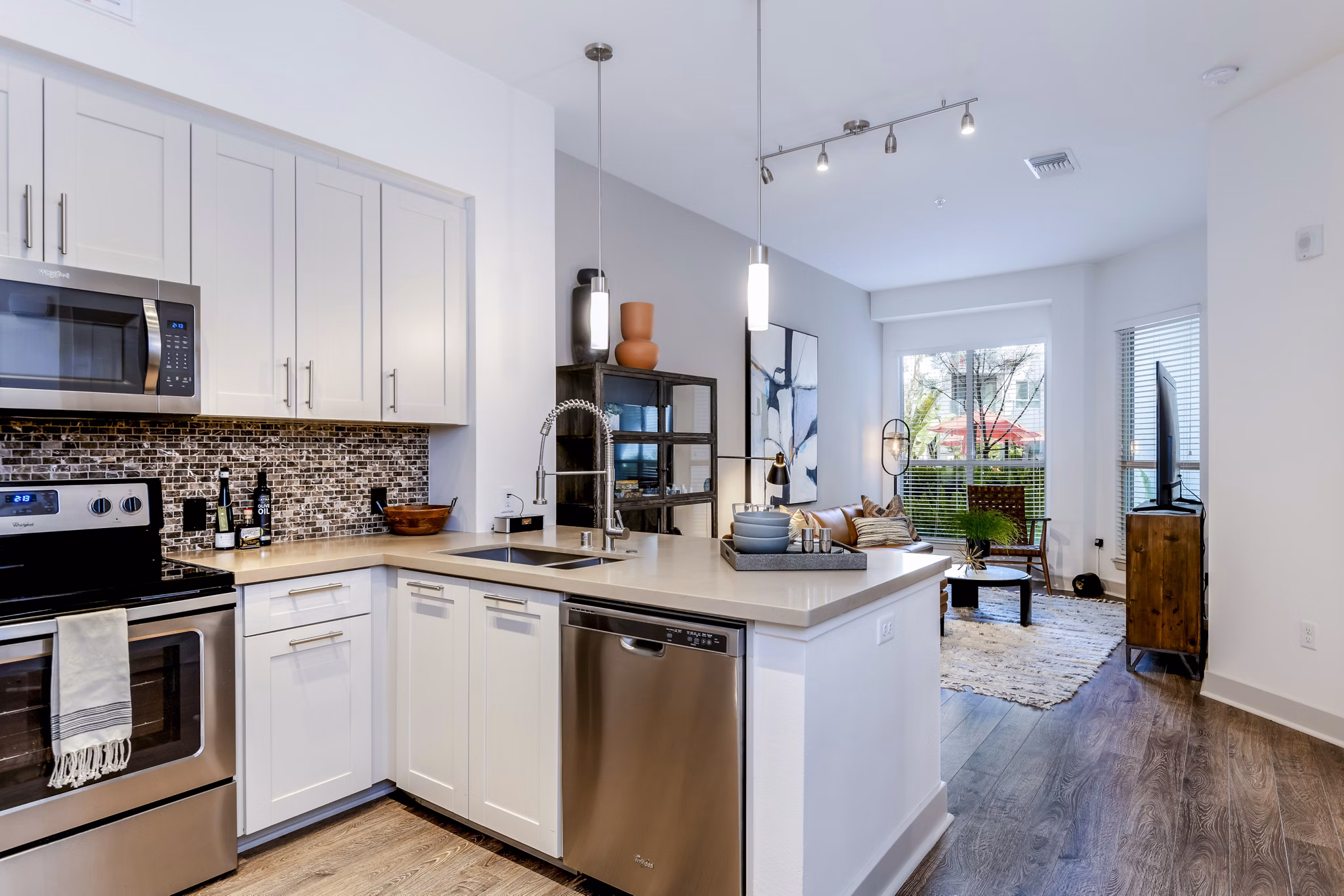 Modern kitchen with stainless steel appliances at Vora Mission Valley East Apartments