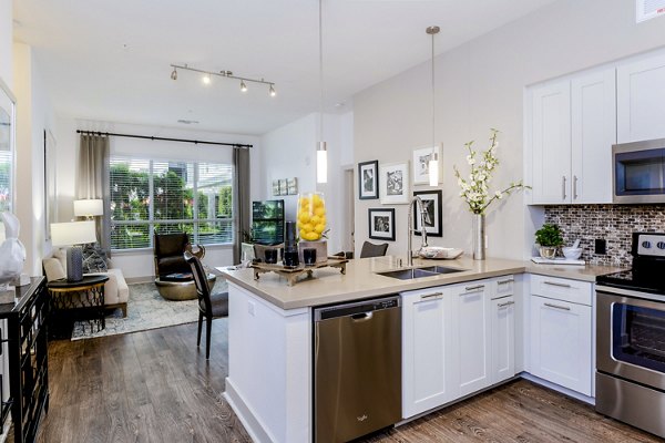 Modern kitchen with stainless steel appliances at Vora Mission Valley East Apartments