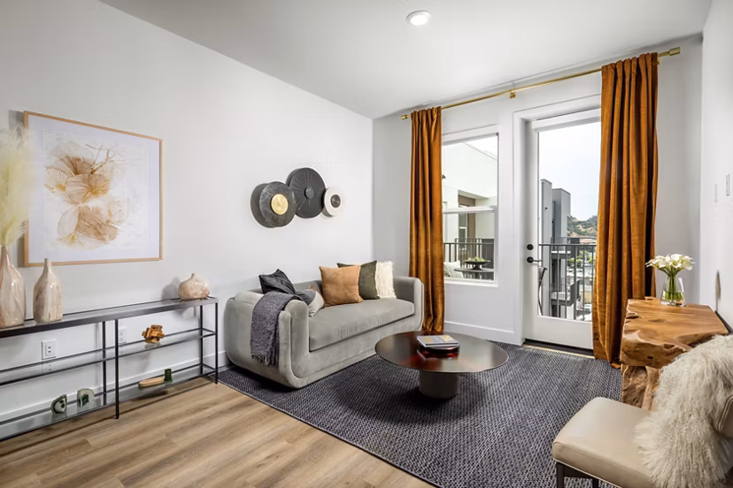 Spacious living room with modern furnishings at Vora Mission Valley East Apartments