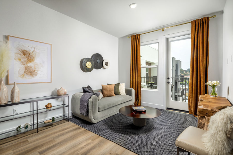Spacious living room with modern furnishings at Vora Mission Valley East Apartments