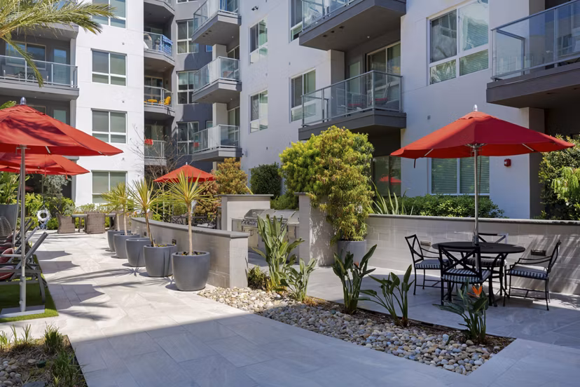 Vora Mission Valley East Apartments: Spacious dog park with agility equipment in San Diego community