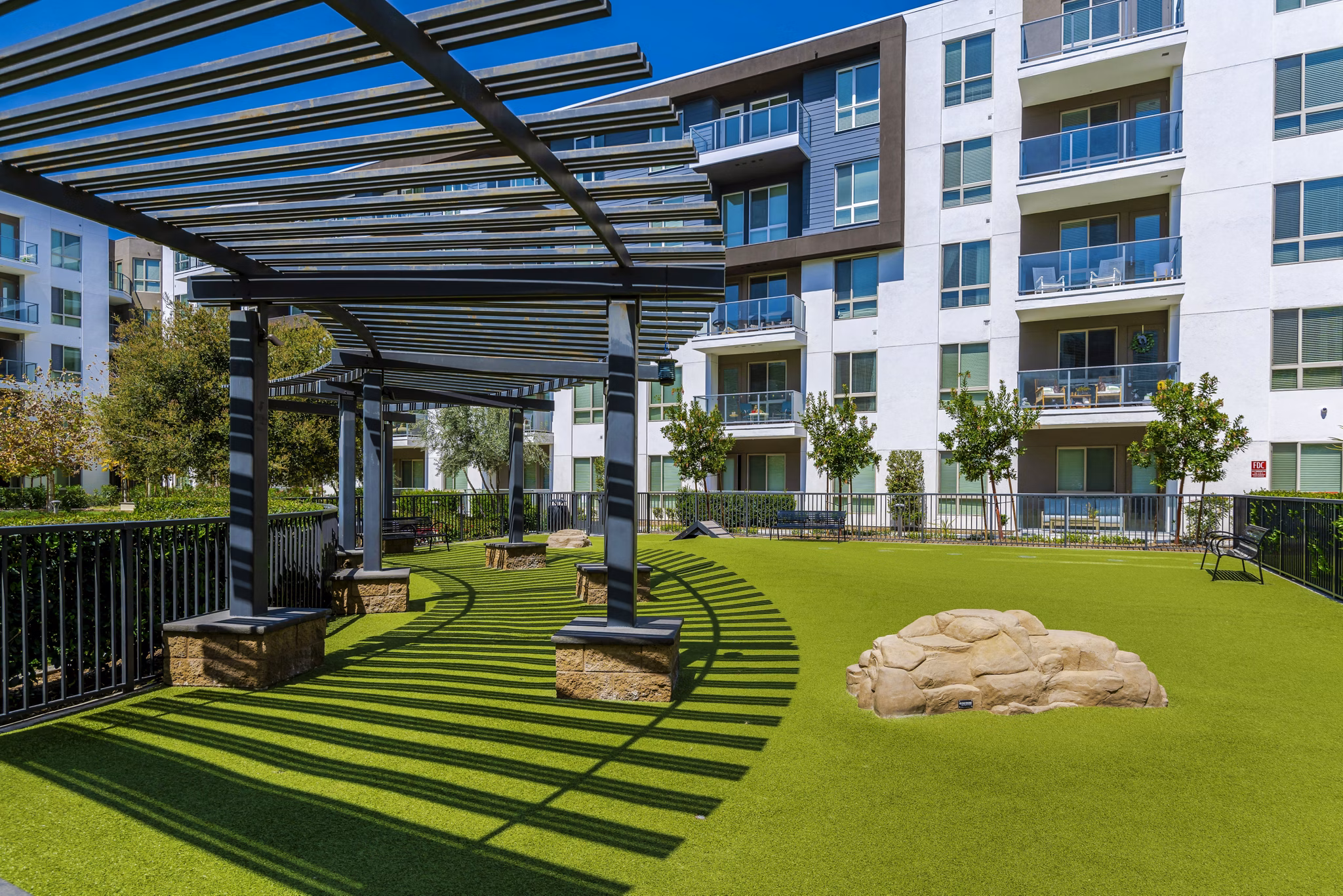 Vora Mission Valley East Apartments: Spacious dog park with agility equipment in San Diego community