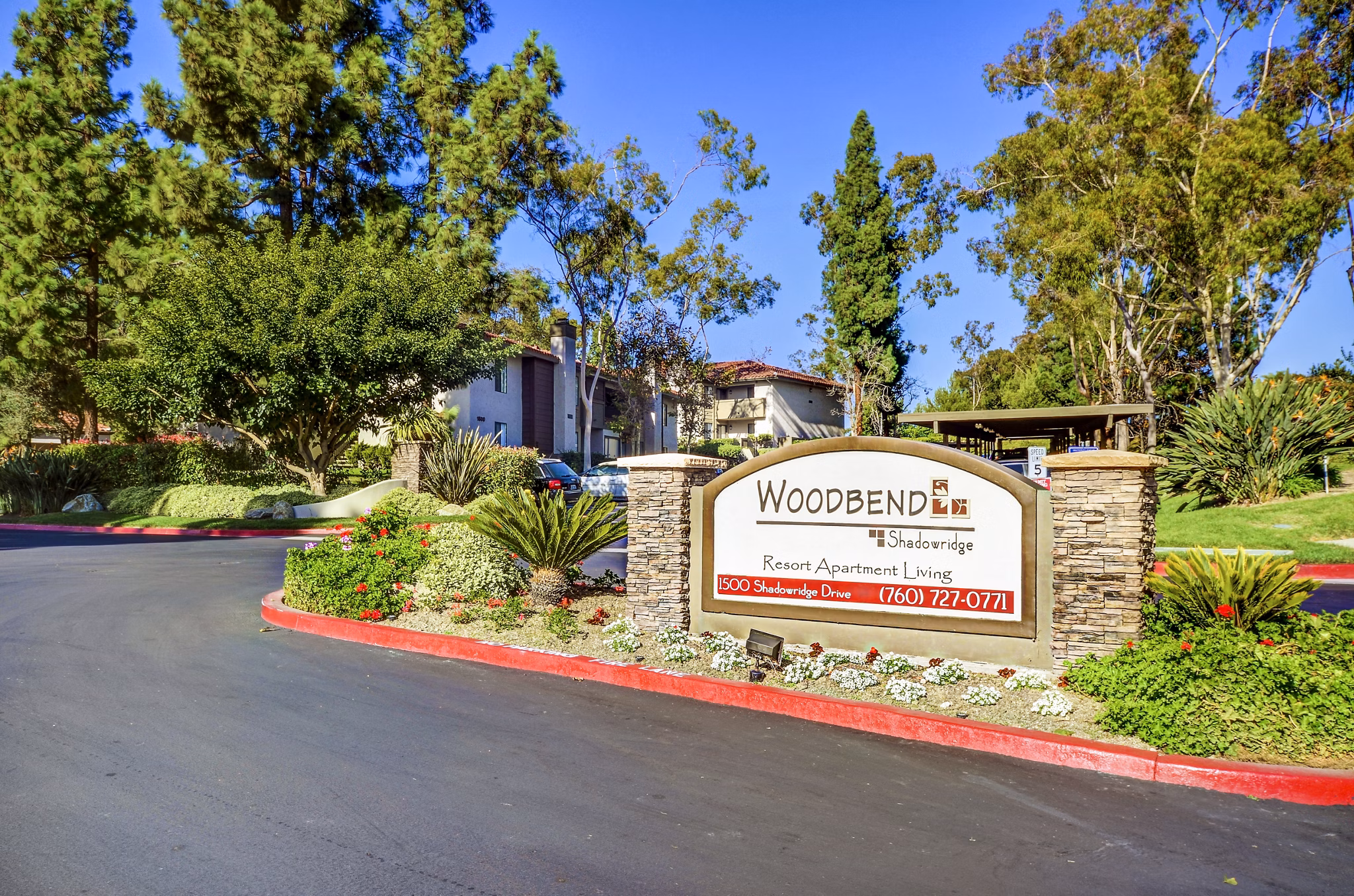 Shadowridge Woodbend Apartments: Elegant signage showcasing luxurious living in a serene residential setting