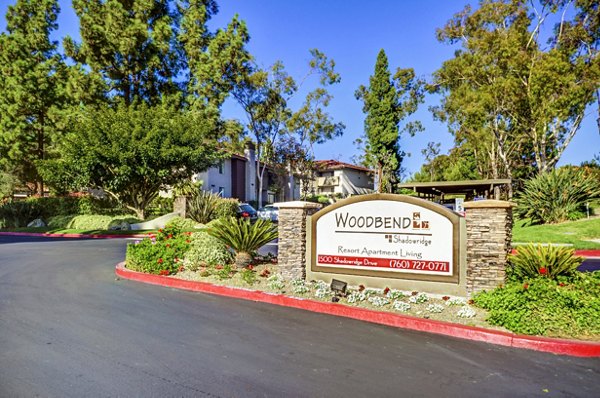 Shadowridge Woodbend Apartments: Elegant signage showcasing luxurious living in a serene residential setting