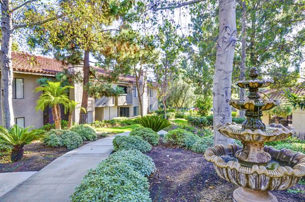 Shadowridge Woodbend: Elegant apartment complex with landscaped grounds in a serene setting