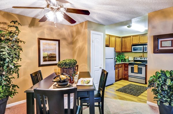 Dining room with elegant lighting and modern decor at Shadowridge Woodbend Apartments, Greystar luxury apartments in a serene community setting