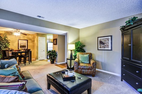 Shadowridge Woodbend Apartments: Cozy living room with modern decor and natural light, perfect for luxury apartment living