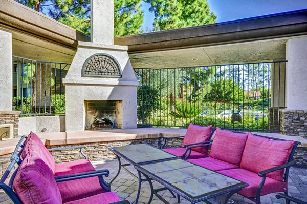 Cozy outdoor fire pit area at Shadowridge Woodbend Apartments with comfortable seating for gatherings in a tranquil setting