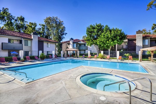 Luxurious hot tub at Shadowridge Woodbend Apartments, offering relaxation in a serene setting