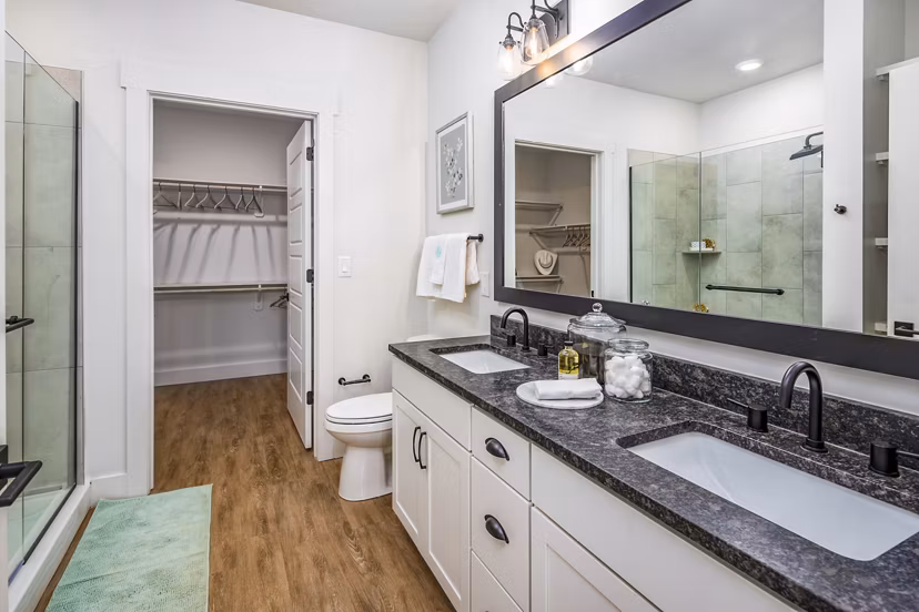 Elegant bathroom with marble countertops and modern fixtures at NOVEL Harpeth Heights by Crescent Communities Apartments