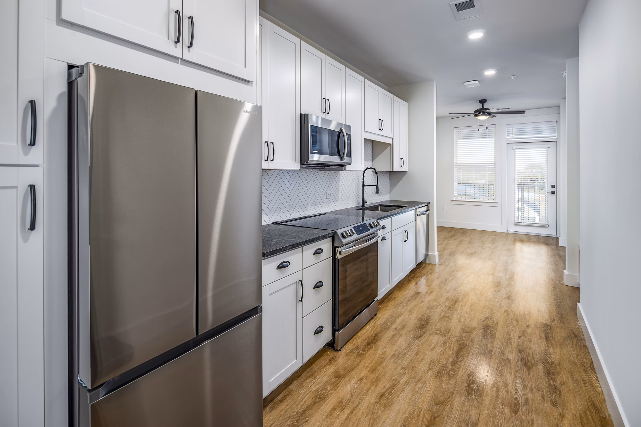 Modern kitchen with stainless steel appliances at NOVEL Harpeth Heights by Crescent Communities Apartments