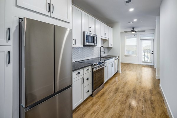 Modern kitchen with stainless steel appliances at NOVEL Harpeth Heights by Crescent Communities Apartments