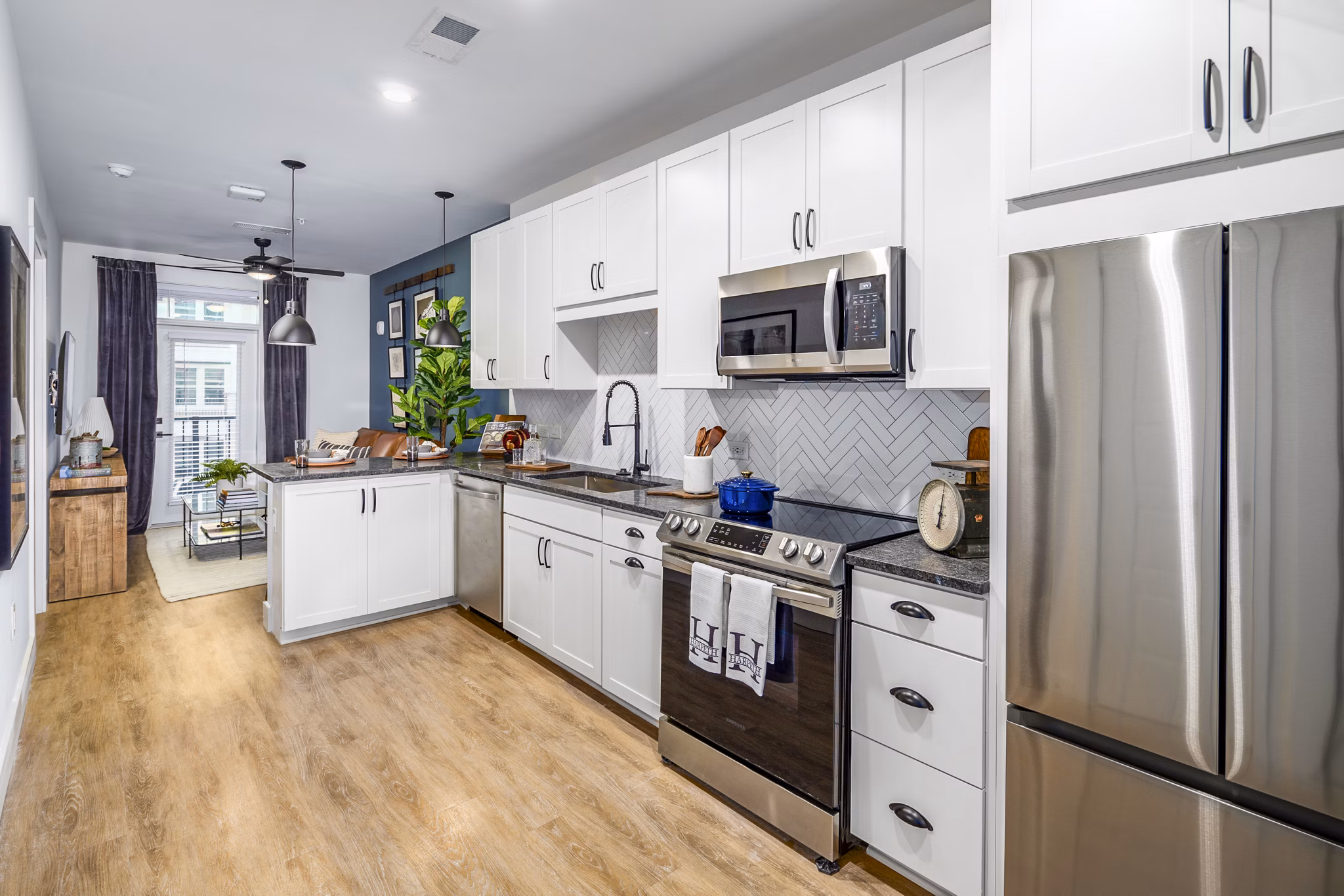 Modern kitchen featuring stainless steel appliances at NOVEL Harpeth Heights by Crescent Communities Apartments