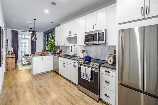 Modern kitchen featuring stainless steel appliances at NOVEL Harpeth Heights by Crescent Communities Apartments