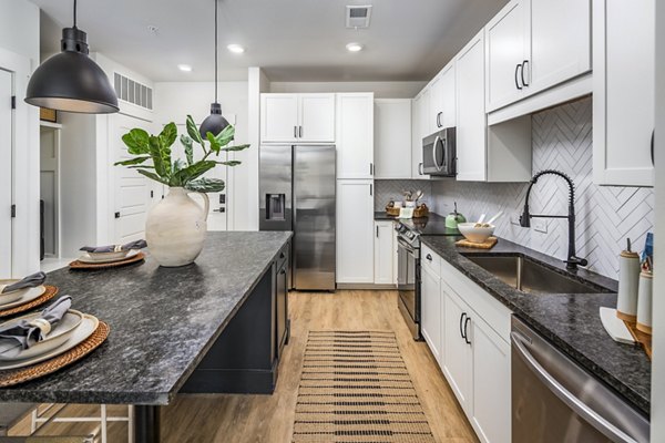 Modern kitchen with sleek countertops and stainless steel appliances at NOVEL Harpeth Heights by Crescent Communities Apartments